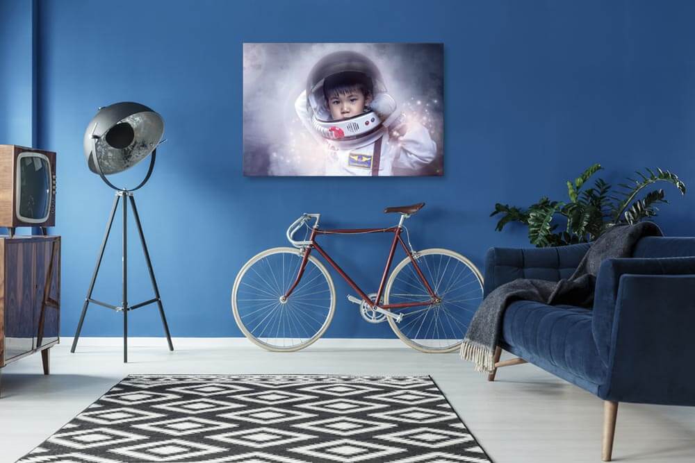 Room scene with Venture framed image of a boy dressed as an astronaut