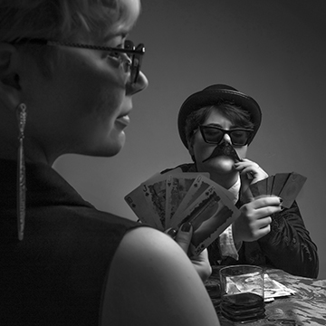 a black and white image of a poker game