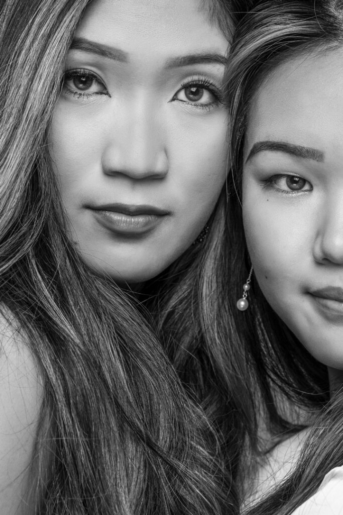 A black and white portrait of two sisters
