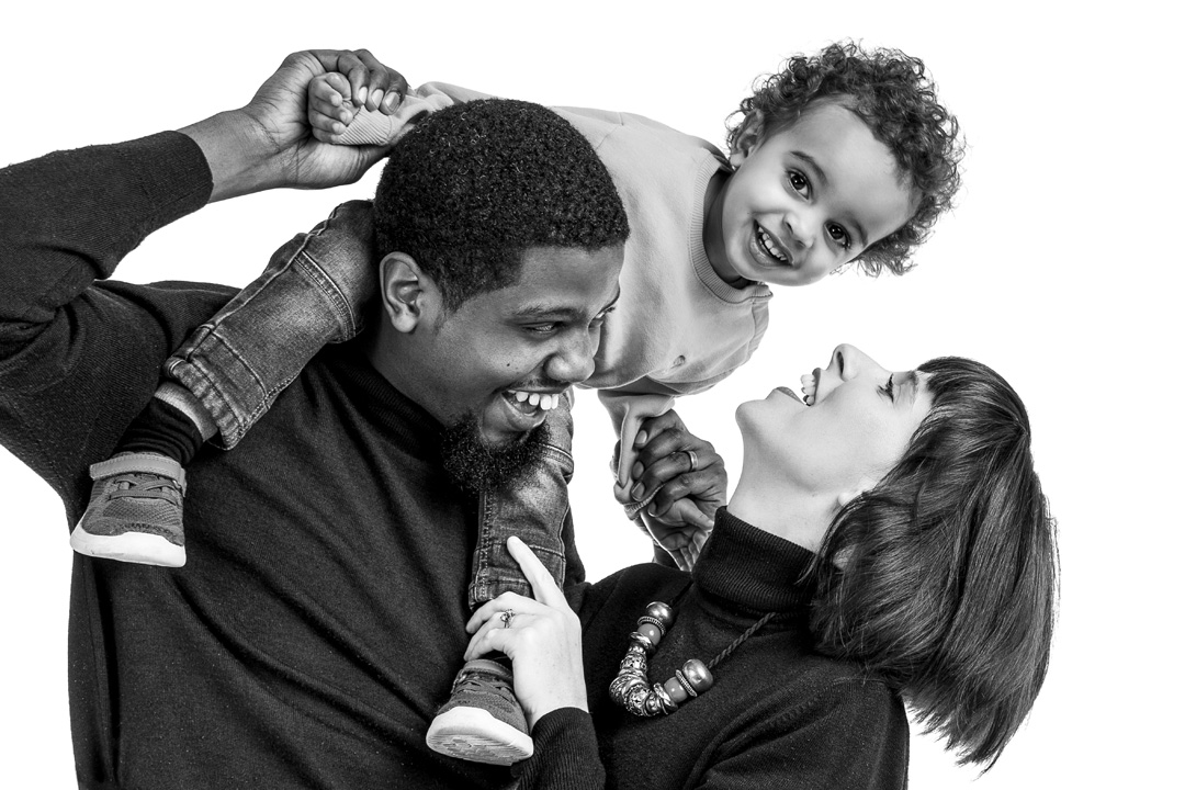 A black and white image of a mixed race family